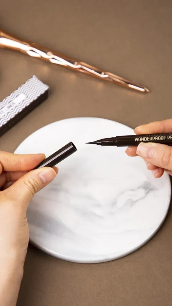 BOM Wonderproof Pen Eye Liner drawing a thin line along the lash line