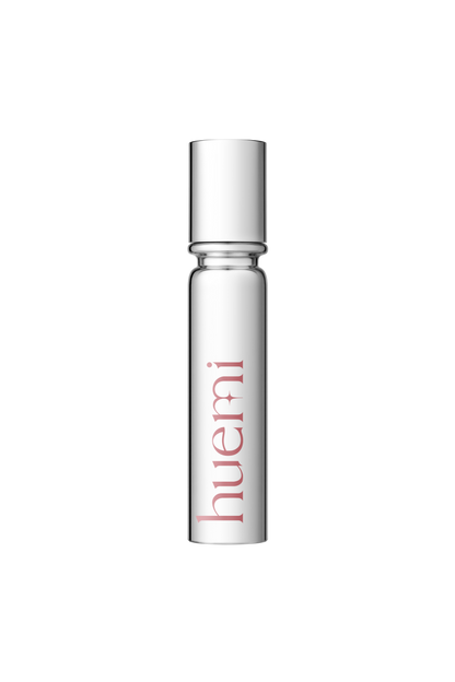 Model applying HUEMI Melting Glaze Lip Gloss 03 On Glam to lips